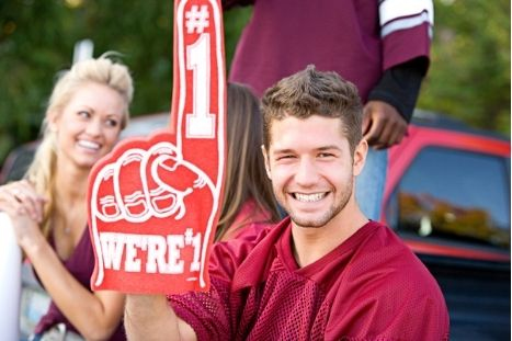 sports fan holding a number 1 hand sign